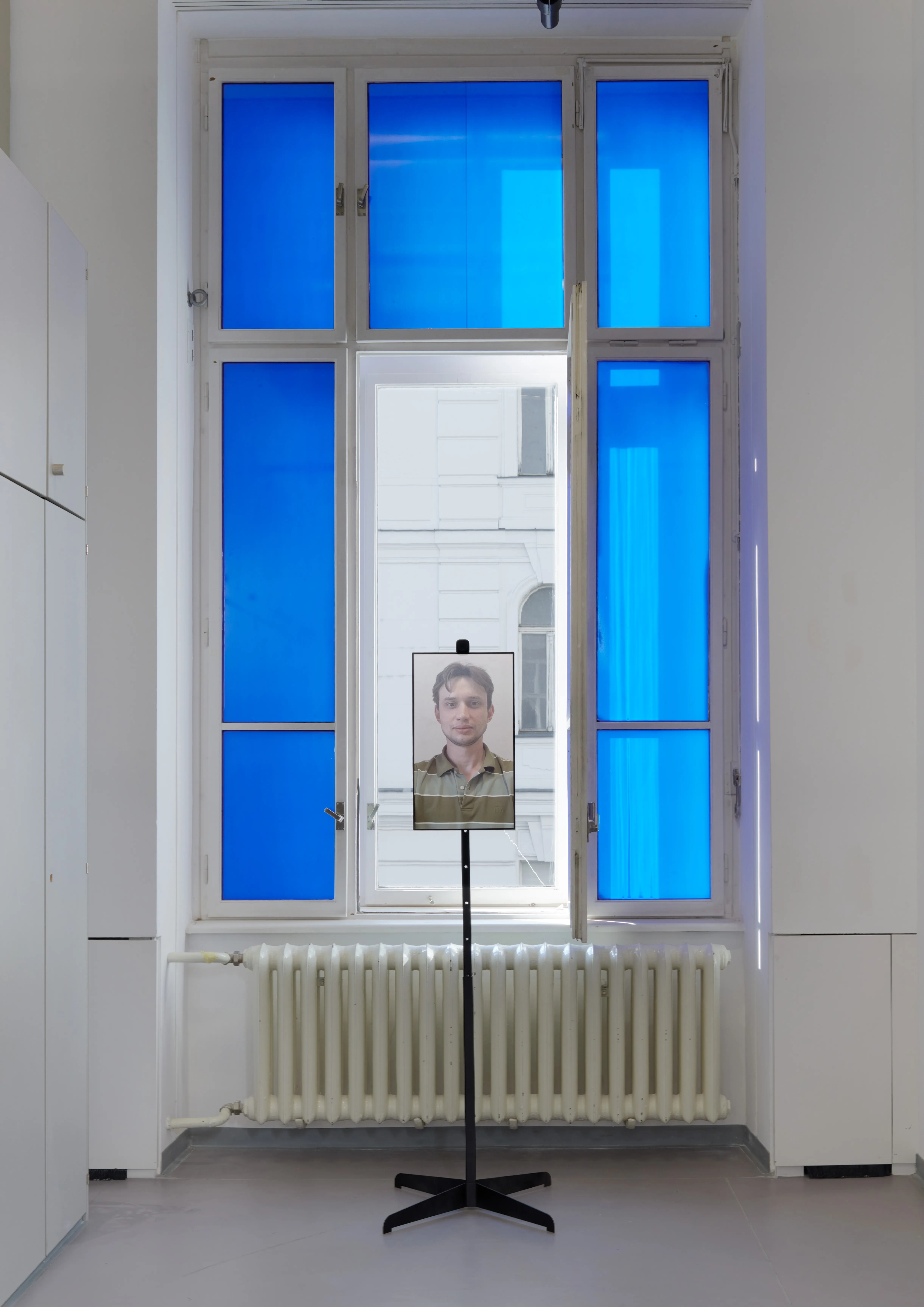 Establishing view: the mirror standing in front of a blue-lit window