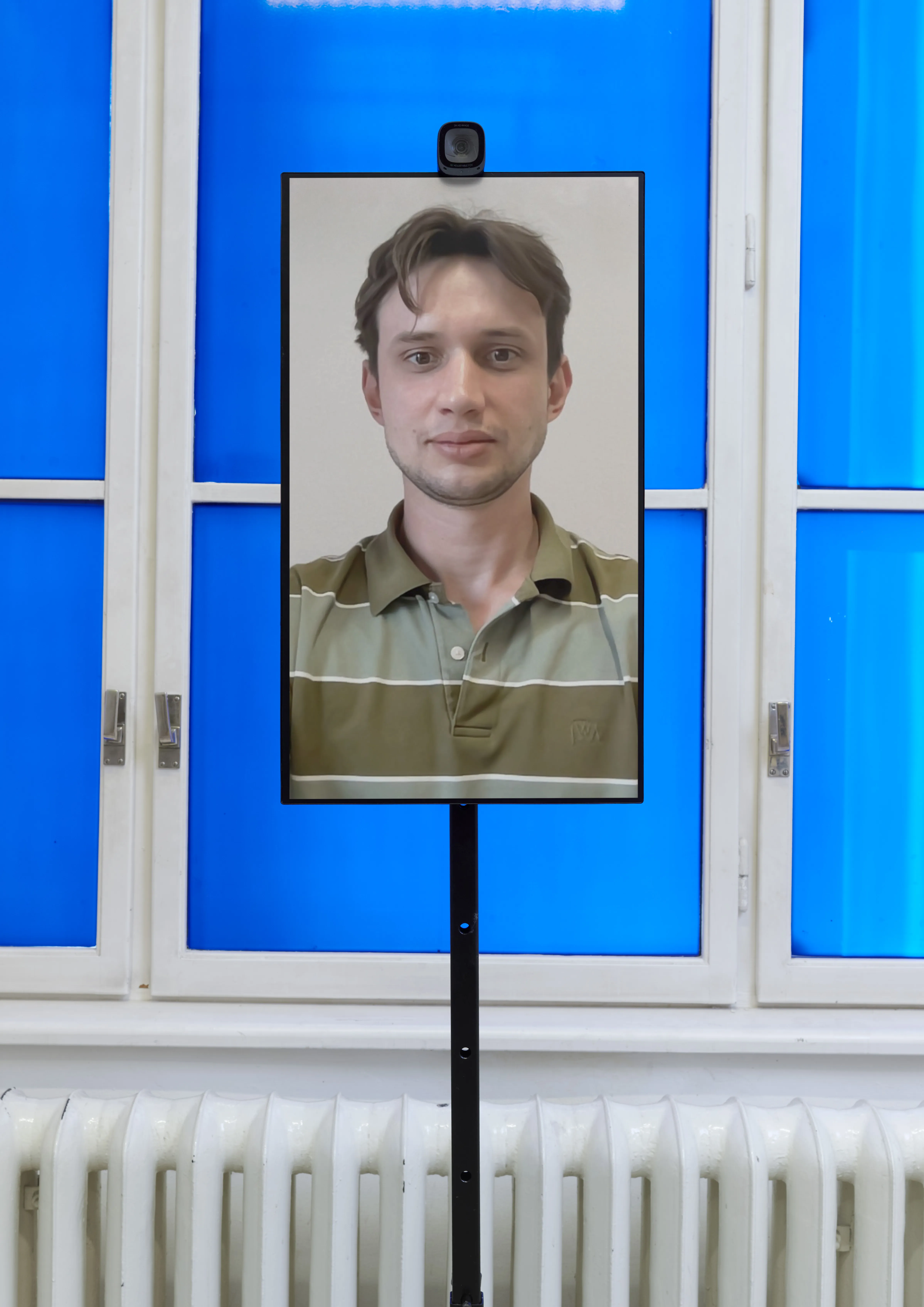 The neutral mirror — your own face, frontal